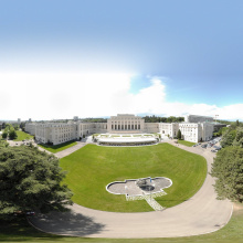 A view from above of the main building and the lush lawns of the Palais des Nations.