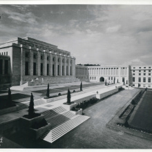 A black and white photography of the Palais des Nations. 