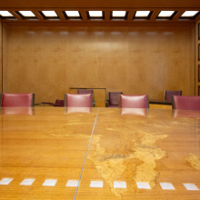 The wooden table with the engraved world map in Room II of C building