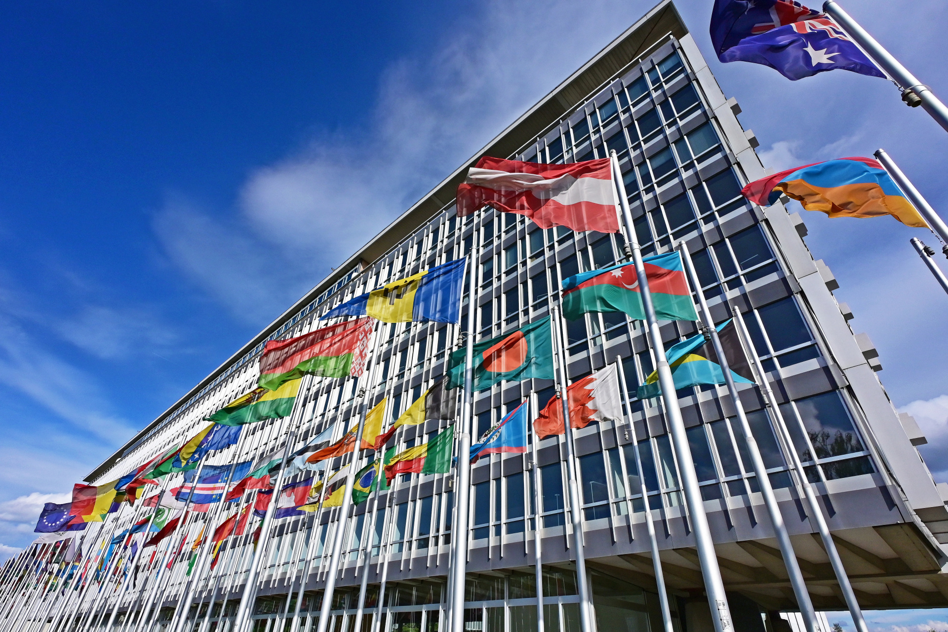 Member States' flags hoisted outside of the WHO building in Geneva