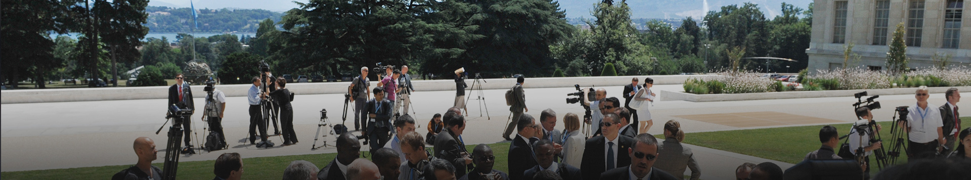 Journalists and videographers muster on the Palais des Nations plaza.