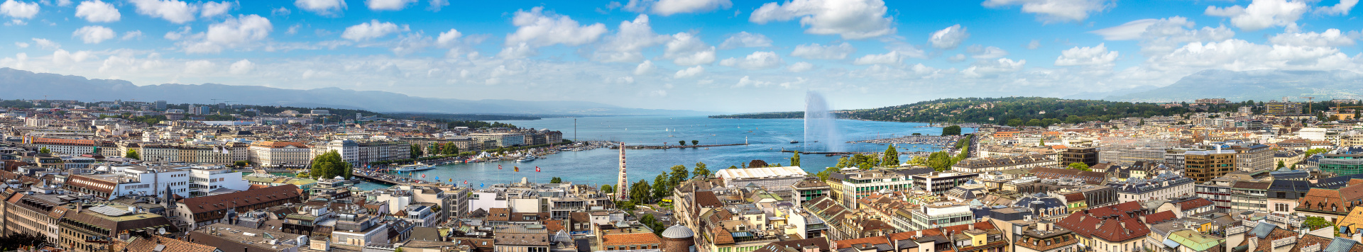 Panoramic view of Geneva with the lake, the jet d'eau and the buildings of the city