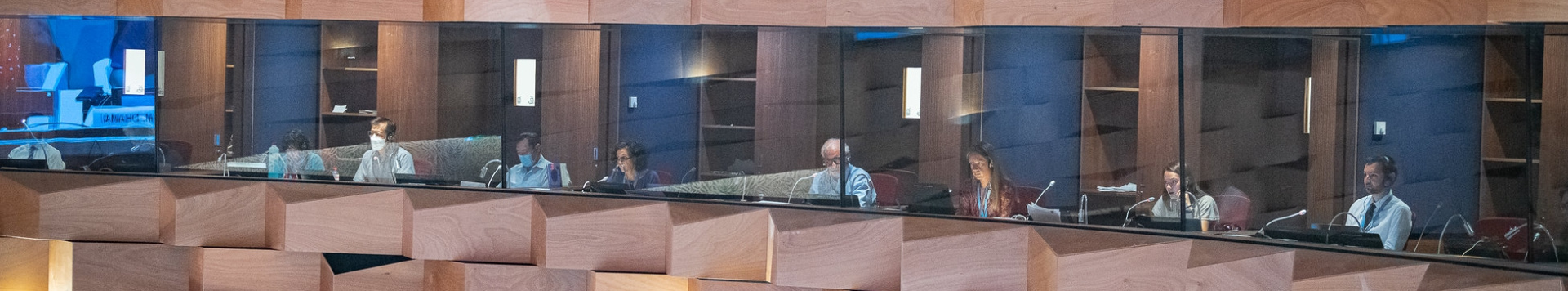 An outside view of the interpretation booths lines up inside one of UN Geneva's conference rooms.