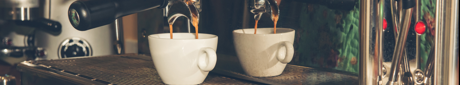 A coffee machine pouring coffee into a cup